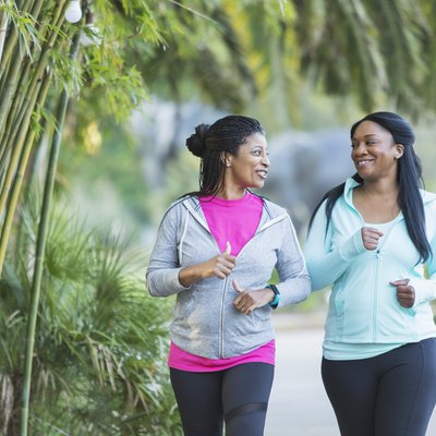 Two African American women jogging together