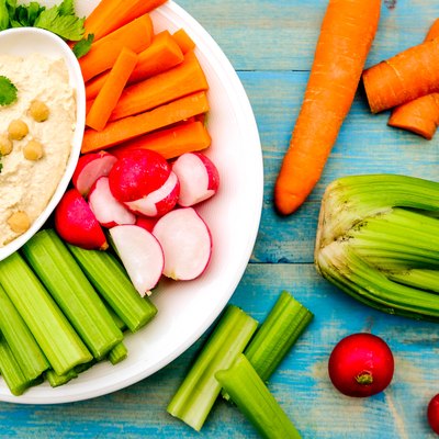 Mediterranean vegetarian hummus dip with fresh vegetables.