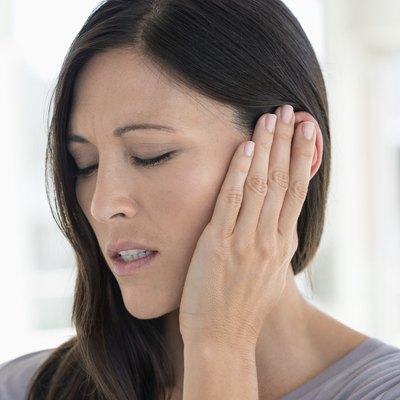 Woman suffering from an ear ache