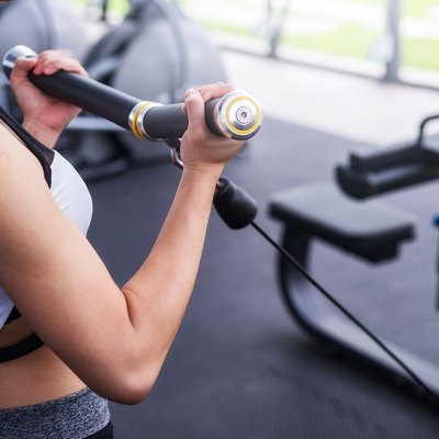 Woman exercise working out in fitness center gym. healthy lifestyle Concept .