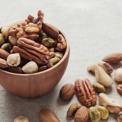 Mixed healthiest nuts in wooden bowl