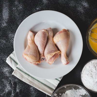 Directly Above Of Chicken In Plate By Ingredients On Table