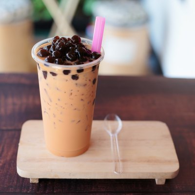 Ice bubble milk tea in takeaway glass