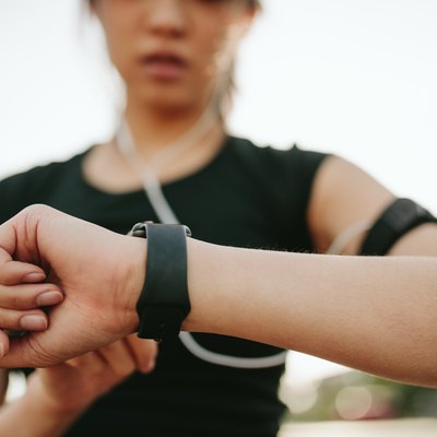 A woman monitoring her performance on a smartwatch