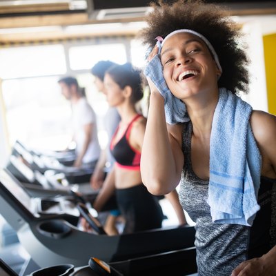 Group of healthy fit people at the gym exercising