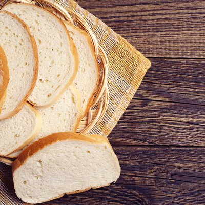 Slices white bread in plate
