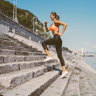 Sports woman jogging upstairs