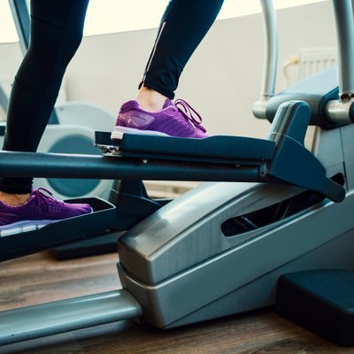 Woman Exercising In Gym.