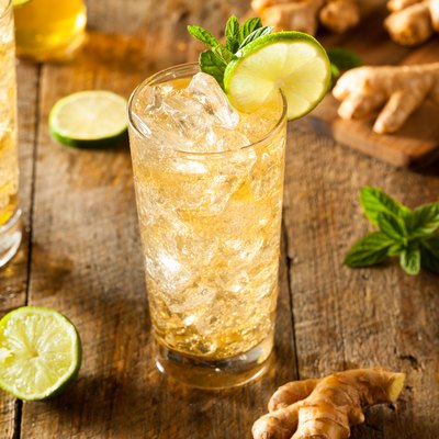 Refreshing golden ginger ale in glass