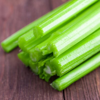 fresh celery on wooden background