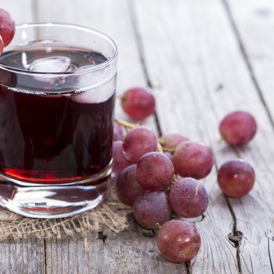 A glass of icy red grape juice
