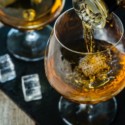 Pouring cognac in a glass