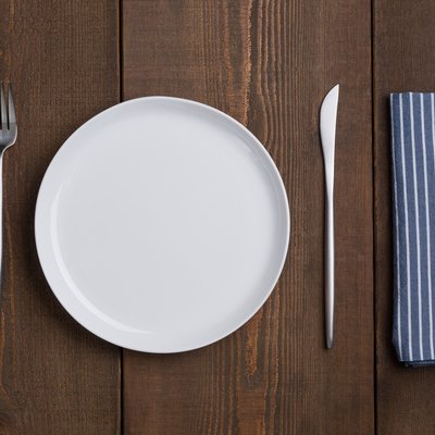 Empty White Plate Table Setting