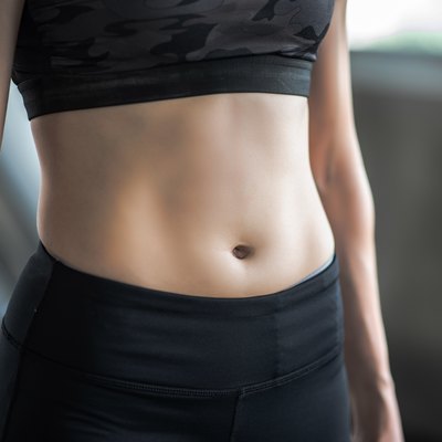 Midsection Of Woman Standing In Gym