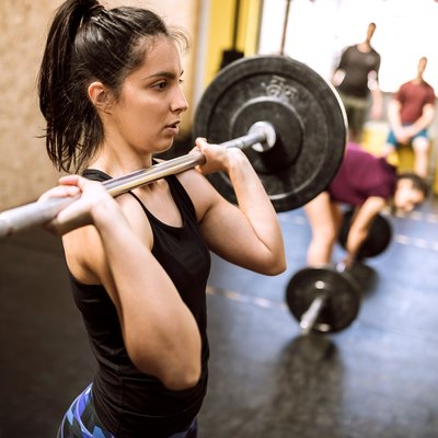 Young woman Preparing for Weightlifting
