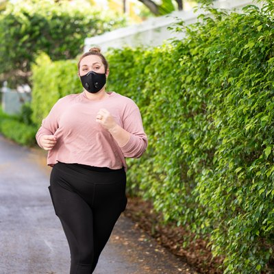 Woman Running with Protective Face Mask Miami Florida