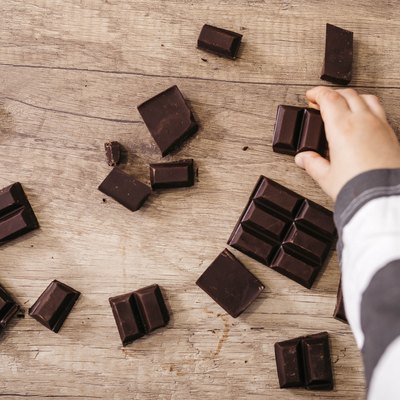 hand taking piece of chocolate