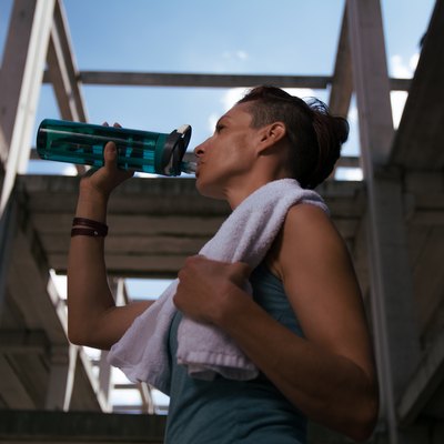 Girl drinking water after exercising