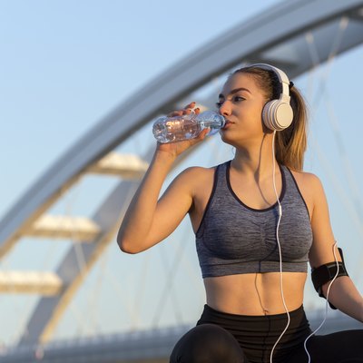 Woman drinking water after outdoor run