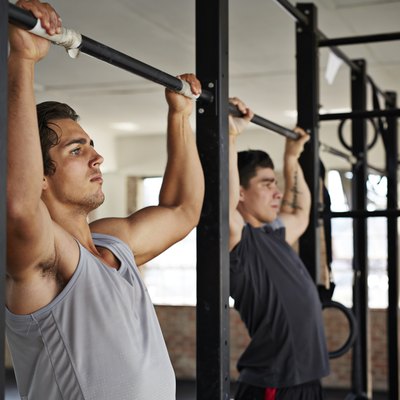 Men doing pull-up's at gym gym