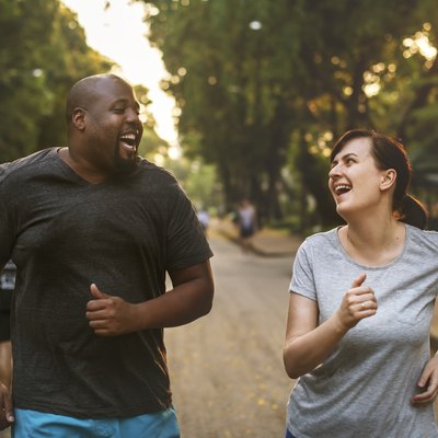 A couple running together in the park to prevent high blood pressure
