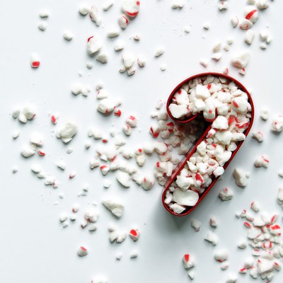 Peppermint In Candy Cane Shaped Pastry Cutter Against White Background