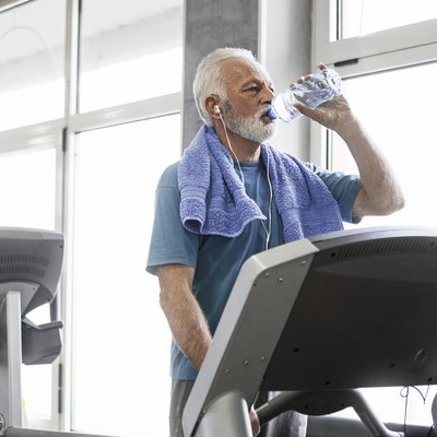 Senior man on a treadmill enjoin run