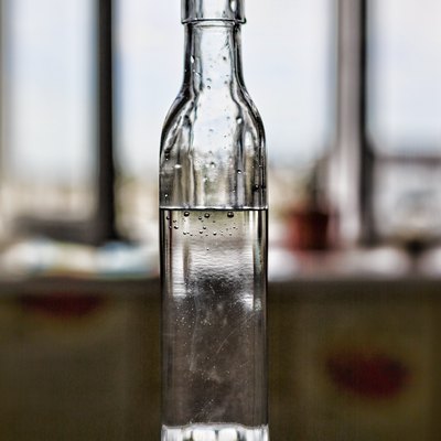 white vinegar on the wooden table top