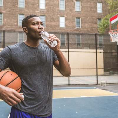 Basketball player training outdoors