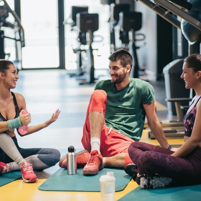 Group of people discussing workout.