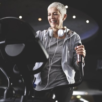 Senior woman exercising at the gym