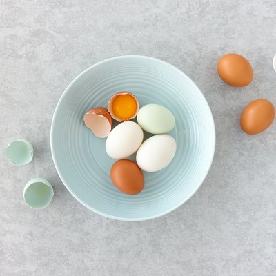 White Duck Eggs in a Blue Bowl