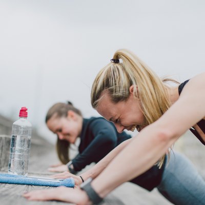 Girlfriends doing push-ups together