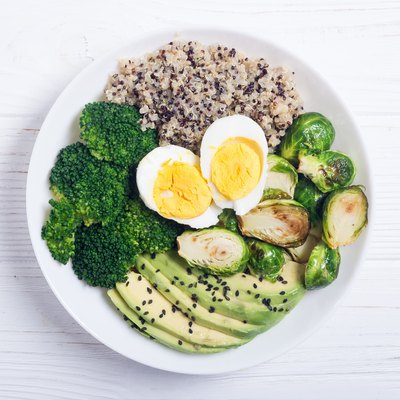 Buddha bowl with quinoa , eggs , avocado , brussels sprouts and broccoli