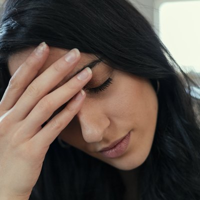 Woman at Home Suffering Migraine