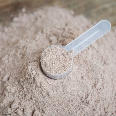 Double chocolate whey protein powder scoop nutrition healthy food bodybuilding.