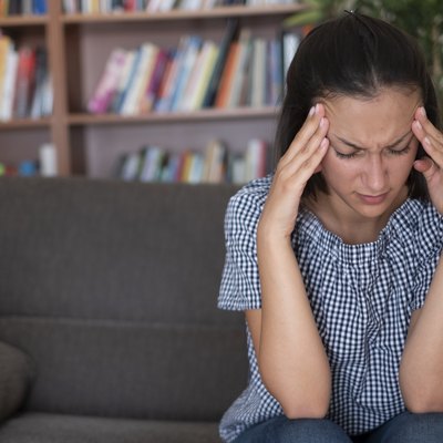 Suffering bad headache and feeling pain in the head