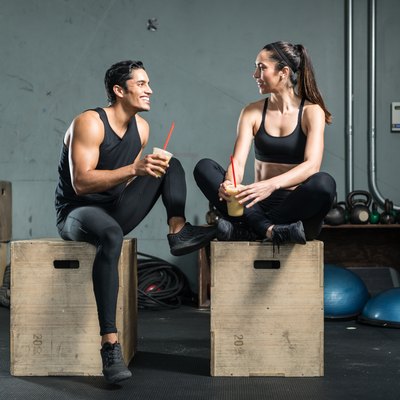 Hispanic Fitness Couple Drinking A Smoothie