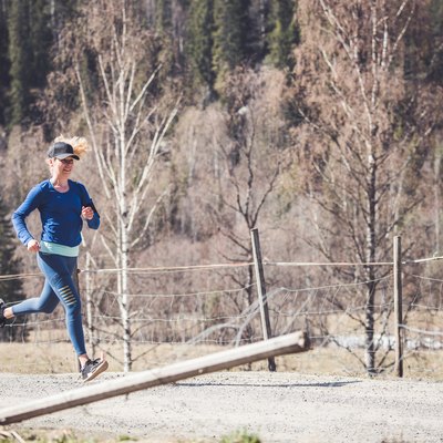 Young female running in nature.