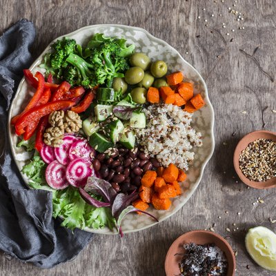 Vegetarian buddha bowl. Raw vegetables and quinoa