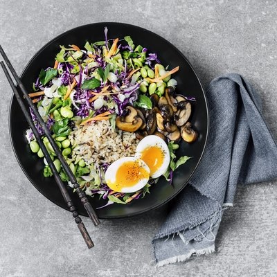 Fresh salad with fried rice and boiled eggs