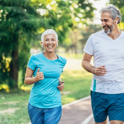Senior couple power walking on a track