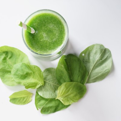 glass of fresh green spinach healthy smoothie
