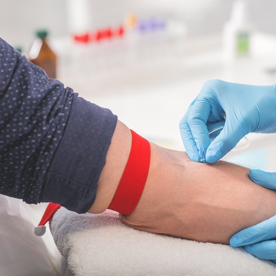 Man having blood collecting in hospital