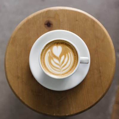 View of coffee cup with latte art straight from above