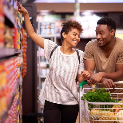 A couple trying to reduce food waste shopping at the grocery store together