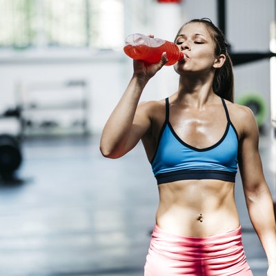 Pretty girl drinks flavored water