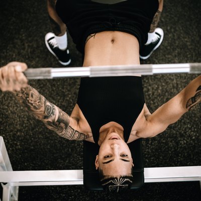 Strong and Fit Woman Working Out in Gym