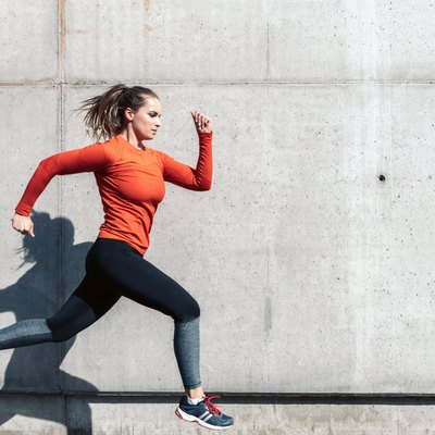 young sportswoman running outdoors