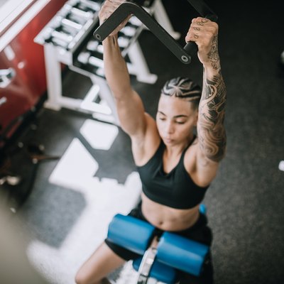 Strong and Fit Woman Working Out in Gym